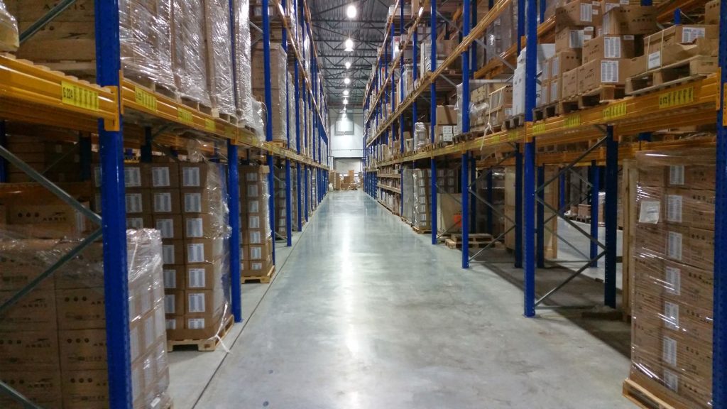 A modern warehouse filled with neatly arranged inventory and cargo packages
