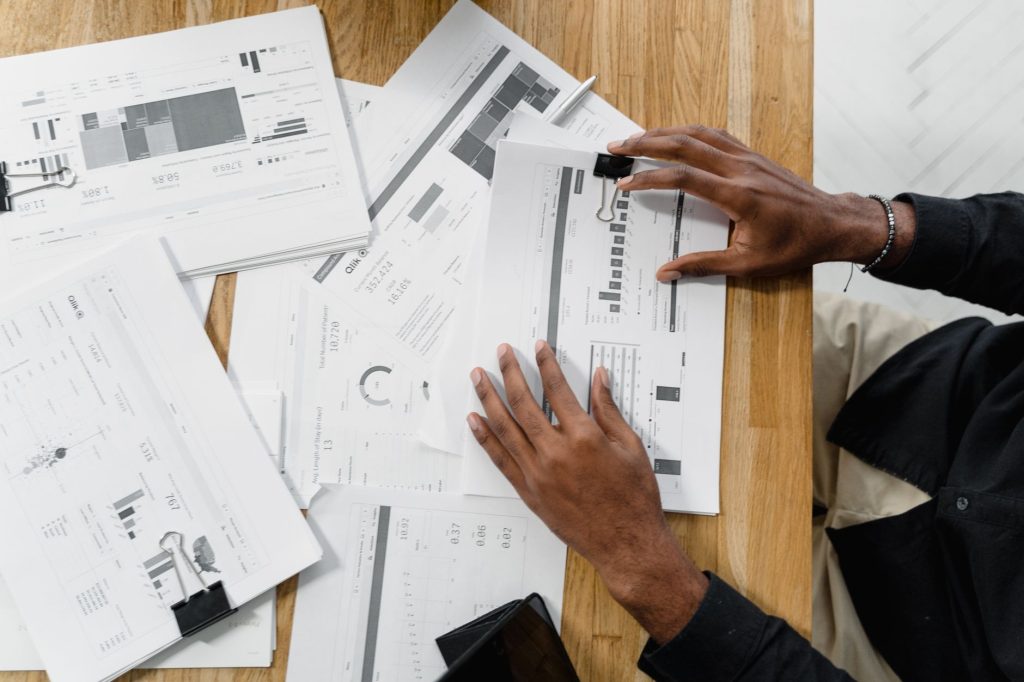 A professional analyzing a structured patent claim breakdown on a computer screen.