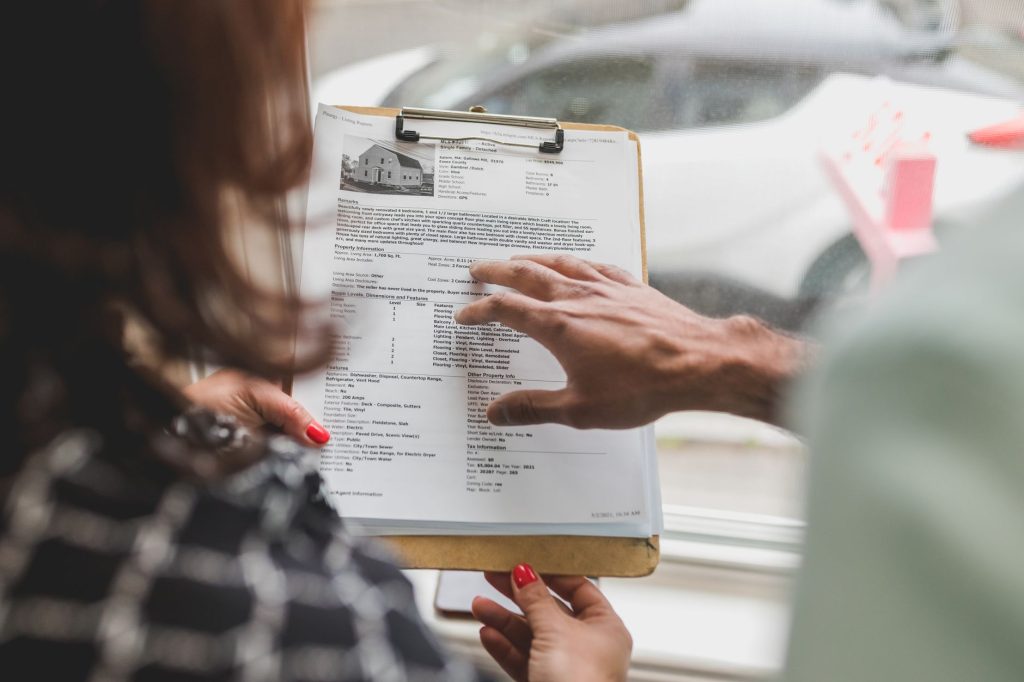 A staff member reviews an AI agent's proposed actions before limited rollout.
