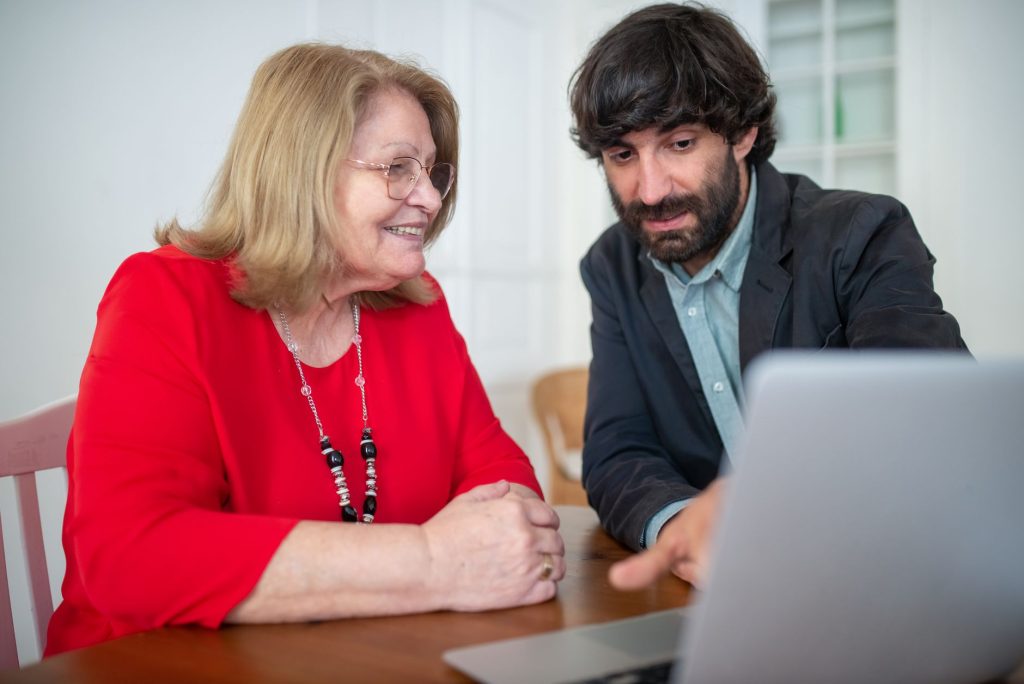 Engineer and customer reviewing a live software implementation together.